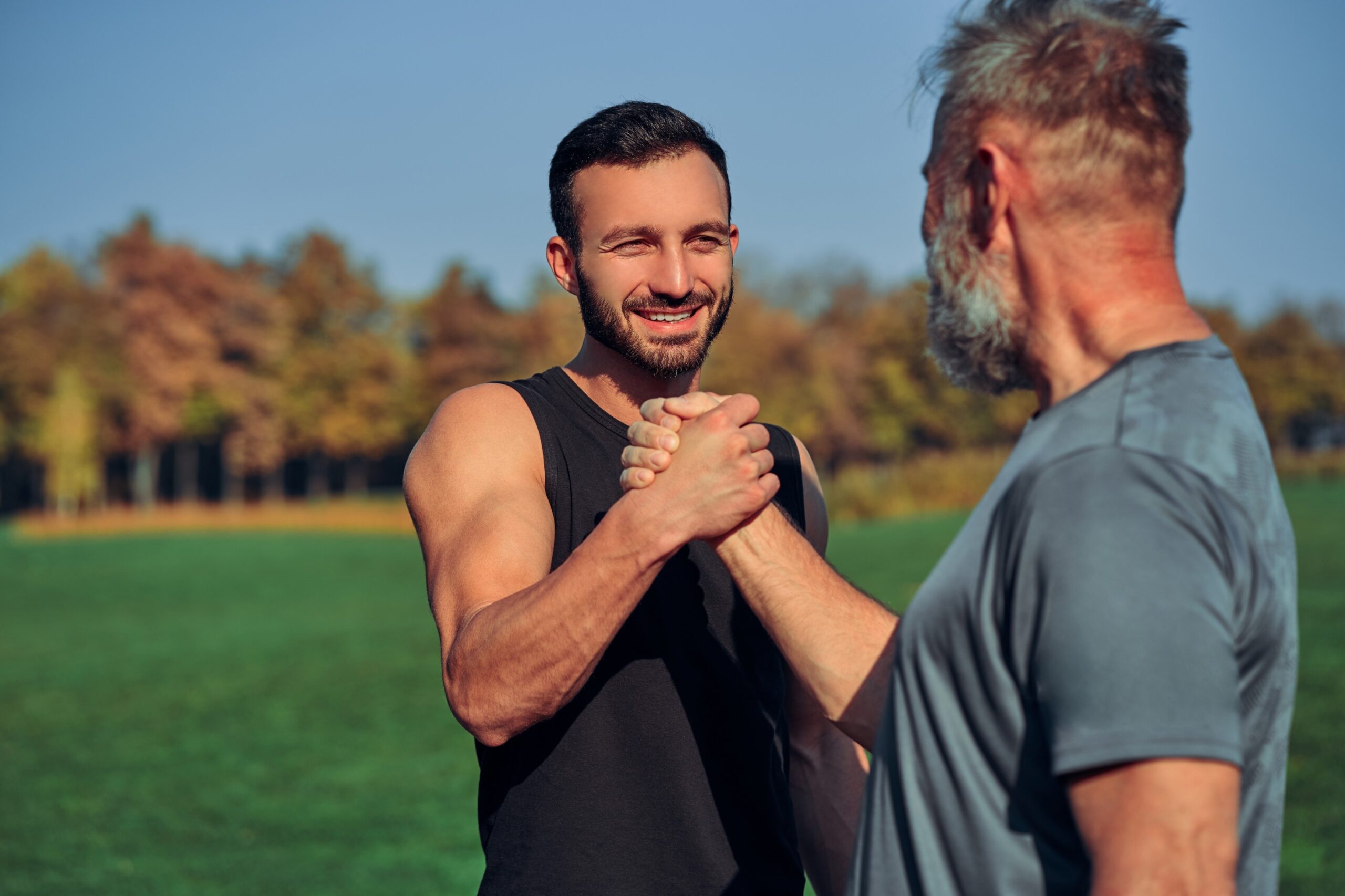 the-two-sportsmen-greeting-outdoor-CVU6WZW